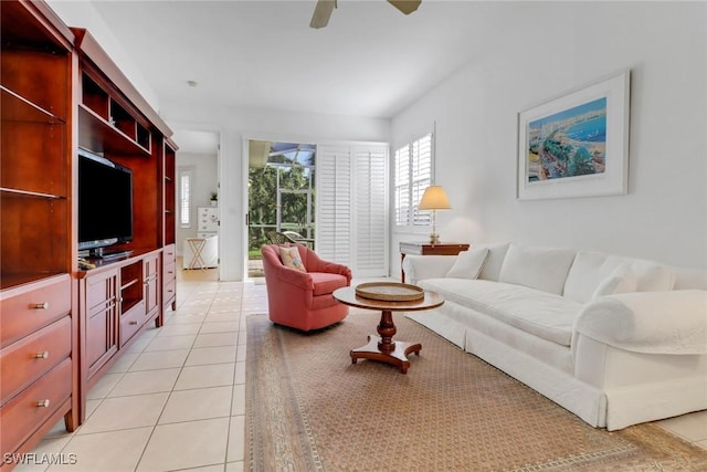 8515 Chase Preserve Dr, Naples, FL 34113 - living area featuring light tile patterned floors and a ceiling fan
