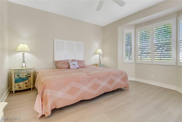 8515 Chase Preserve Dr, Naples, FL 34113 - bedroom featuring light wood-style flooring, baseboards, and ceiling fan