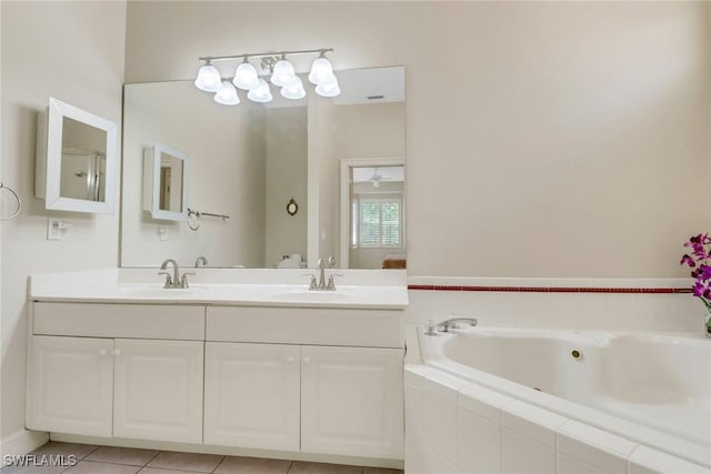 8515 Chase Preserve Dr, Naples, FL 34113 - bathroom featuring a jetted tub and double vanity