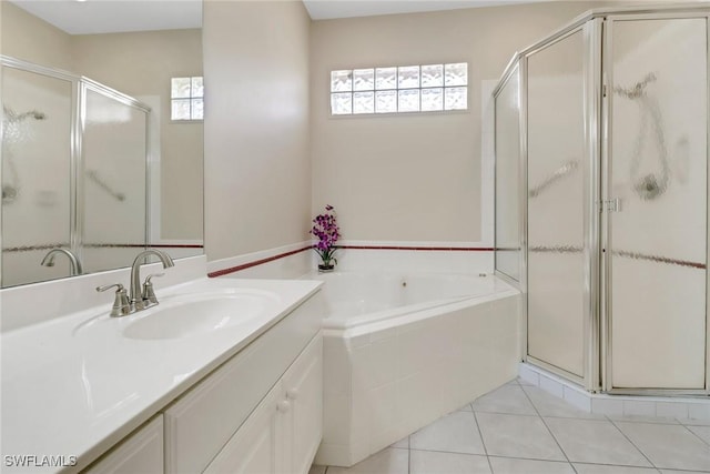 8515 Chase Preserve Dr, Naples, FL 34113 - full bathroom featuring a shower stall, vanity, a garden tub, and tile patterned floors