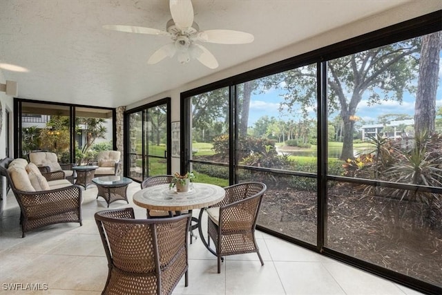 5964 Pelican Bay Blvd Unit 415, Naples, FL 34108 - sunroom with ceiling fan, healthy amount of natural light, and an outdoor hangout area