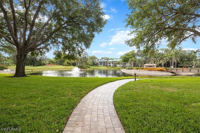 5964 Pelican Bay Blvd Unit 415, Naples, FL 34108 - view of property's community with a water view and a yard