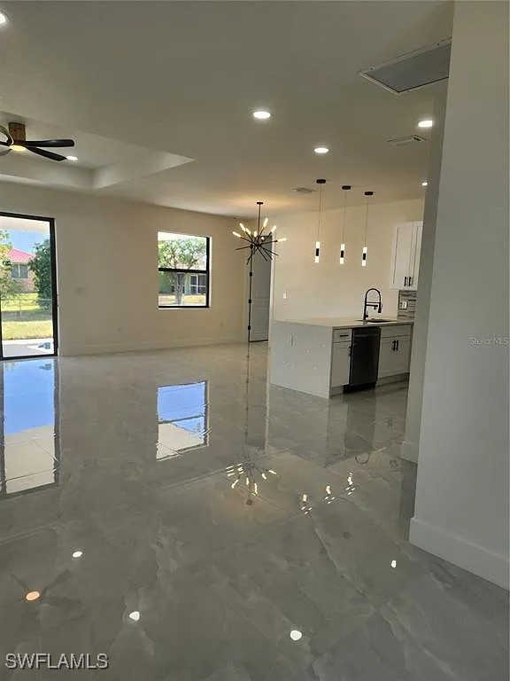 3017 4th St W, Lehigh Acres, FL 33971 - spare room featuring recessed lighting, light marble finish floors, baseboards, and a ceiling fan