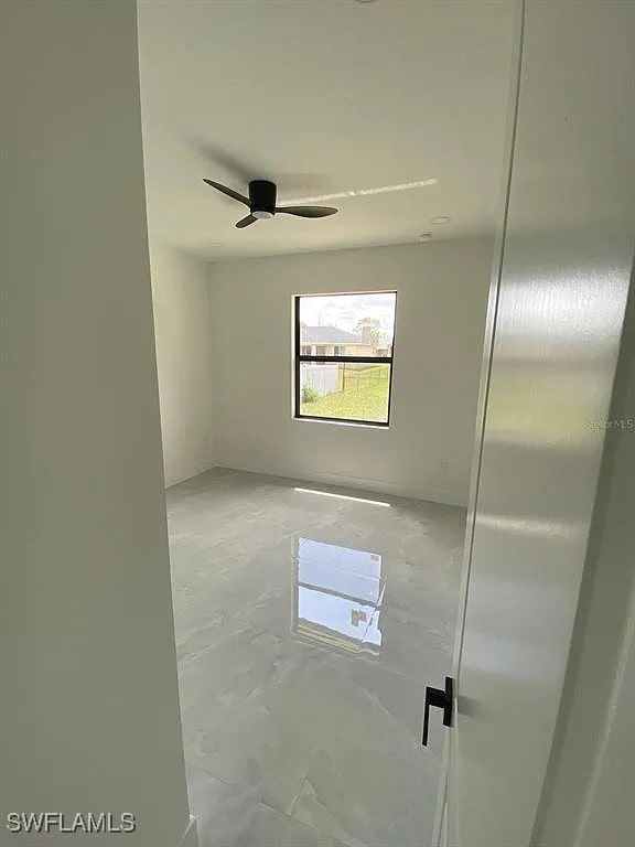 3017 4th St W, Lehigh Acres, FL 33971 - unfurnished room with ceiling fan