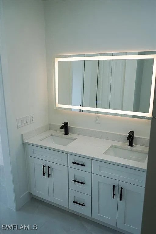 3017 4th St W, Lehigh Acres, FL 33971 - full bathroom featuring double vanity