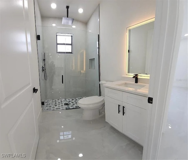 3017 4th St W, Lehigh Acres, FL 33971 - bathroom with a stall shower, vanity, and toilet