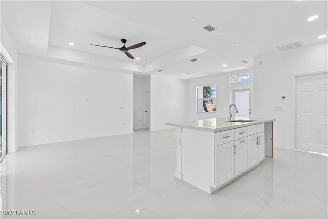 3507 41st St SW, Lehigh Acres, FL 33976 - kitchen with a sink, open floor plan, ceiling fan, recessed lighting, and white cabinets