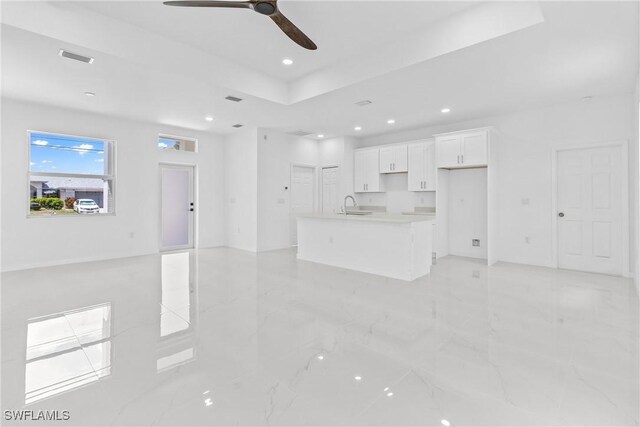3507 41st St SW, Lehigh Acres, FL 33976 - unfurnished living room with ceiling fan, light marble finish flooring, recessed lighting, and a sink