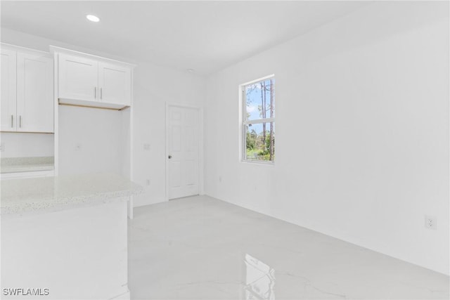 3507 41st St SW, Lehigh Acres, FL 33976 - unfurnished dining area featuring light marble finish flooring and recessed lighting