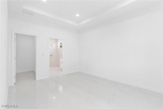 3507 41st St SW, Lehigh Acres, FL 33976 - unfurnished bedroom with light marble finish floors, baseboards, recessed lighting, and ensuite bathroom