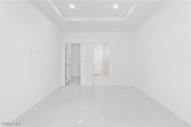 3507 41st St SW, Lehigh Acres, FL 33976 - spare room featuring recessed lighting, a raised ceiling, and baseboards
