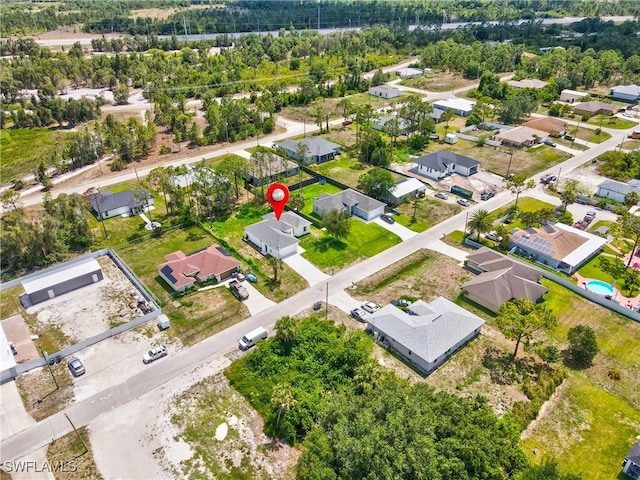 3507 41st St SW, Lehigh Acres, FL 33976 - aerial view of residential area featuring a tree filled landscape