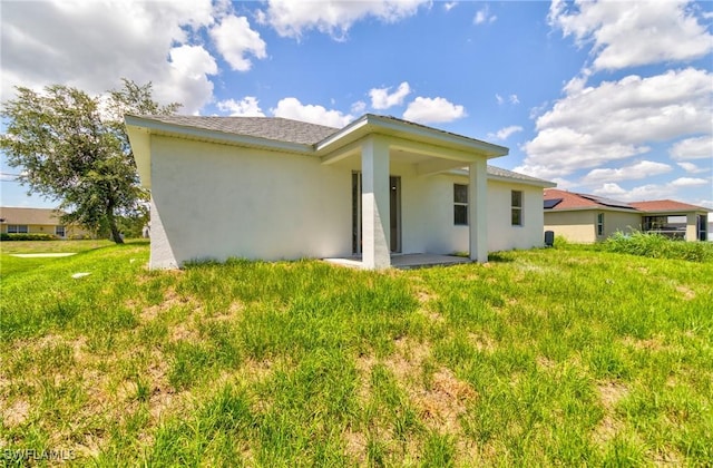 3507 41st St SW, Lehigh Acres, FL 33976 - rear view of house with stucco siding