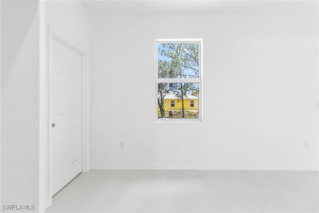 3507 41st St SW, Lehigh Acres, FL 33976 - unfurnished room featuring marble tiled flooring