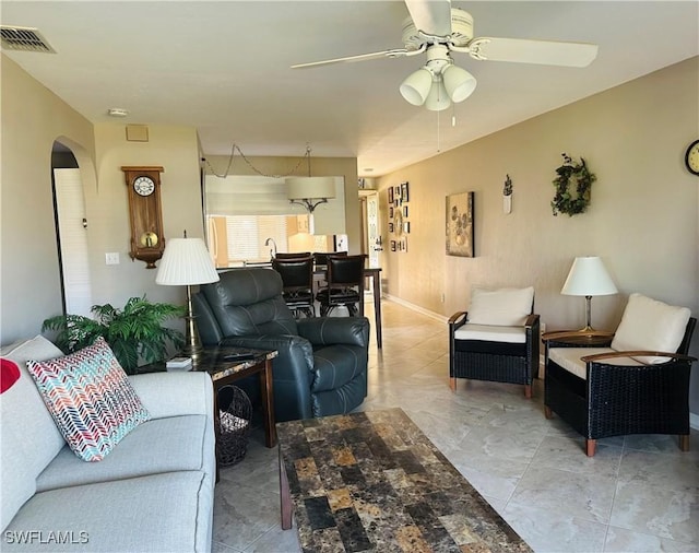 11460 Caravel Cir Unit 5009, Fort Myers, FL 33908 - living room featuring ceiling fan and arched walkways