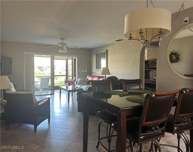 11460 Caravel Cir Unit 5009, Fort Myers, FL 33908 - dining room featuring a ceiling fan and light tile patterned flooring
