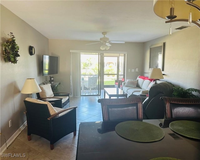 11460 Caravel Cir Unit 5009, Fort Myers, FL 33908 - living room featuring a ceiling fan, light tile patterned floors, and baseboards