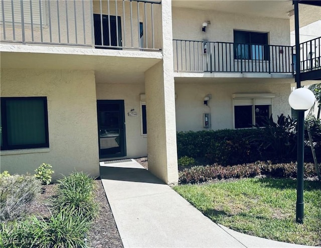 11460 Caravel Cir Unit 5009, Fort Myers, FL 33908 - property entrance featuring stucco siding and a balcony
