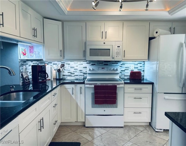 11460 Caravel Cir Unit 5009, Fort Myers, FL 33908 - kitchen featuring white appliances, a raised ceiling, a sink, tasteful backsplash, and ornamental molding