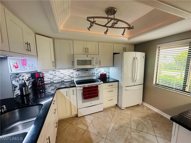 11460 Caravel Cir Unit 5009, Fort Myers, FL 33908 - kitchen featuring white appliances, a tray ceiling, a sink, and dark countertops