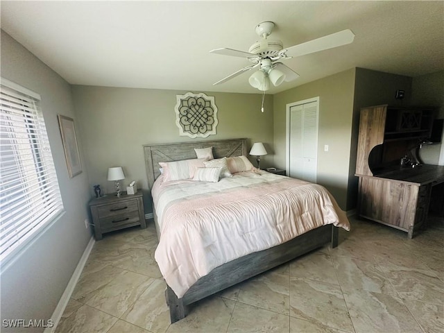 11460 Caravel Cir Unit 5009, Fort Myers, FL 33908 - bedroom with light marble finish floors, baseboards, a closet, and a ceiling fan