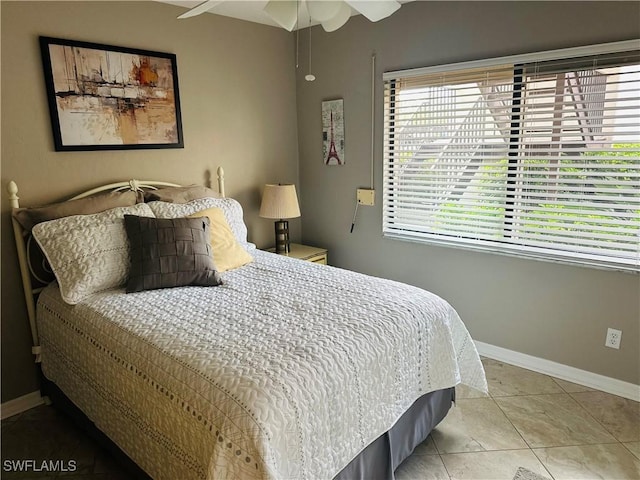 11460 Caravel Cir Unit 5009, Fort Myers, FL 33908 - bedroom with light tile patterned floors, baseboards, and a ceiling fan