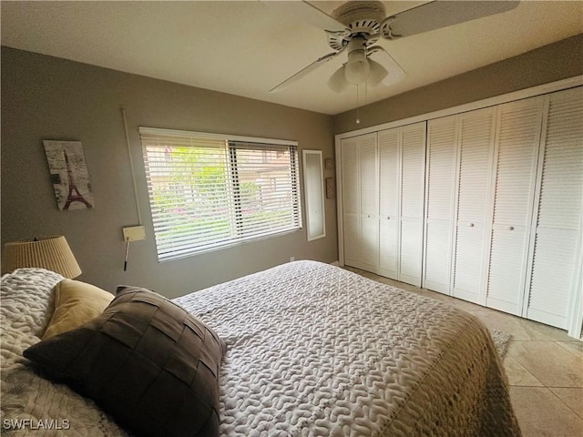 11460 Caravel Cir Unit 5009, Fort Myers, FL 33908 - bedroom with light tile patterned floors, a ceiling fan, and a closet