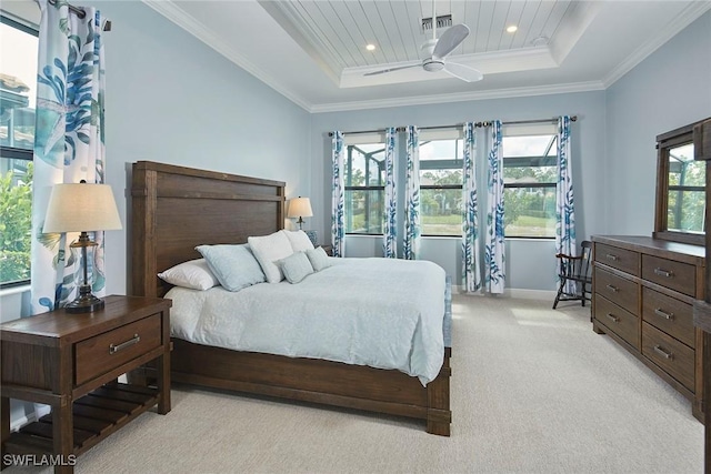 4551 Tamarind Way, Naples, FL 34119 - bedroom with a tray ceiling, light colored carpet, recessed lighting, ornamental molding, and baseboards