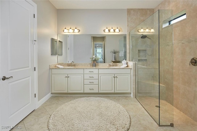 4551 Tamarind Way, Naples, FL 34119 - bathroom with double vanity, walk in shower, tile patterned floors, and baseboards