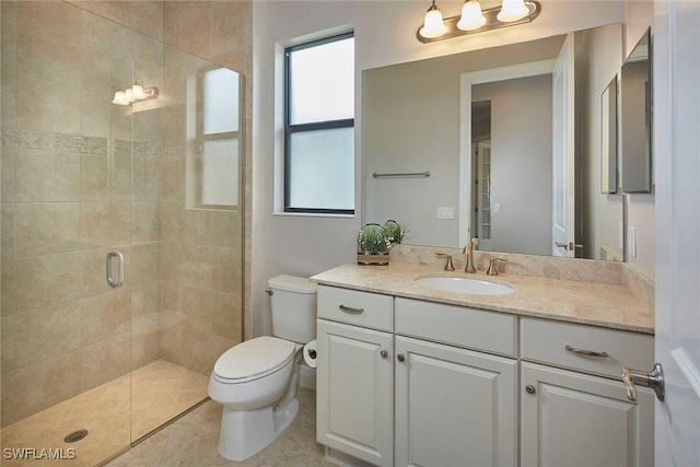 4551 Tamarind Way, Naples, FL 34119 - bathroom featuring toilet, a stall shower, vanity, and tile patterned floors