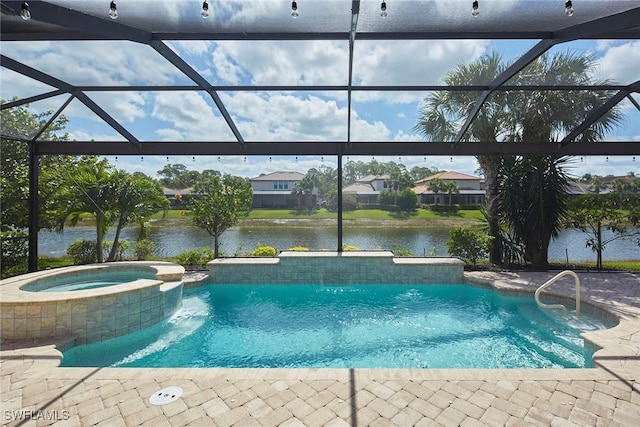 4551 Tamarind Way, Naples, FL 34119 - view of pool featuring a pool with connected hot tub, glass enclosure, a water view, and a patio area
