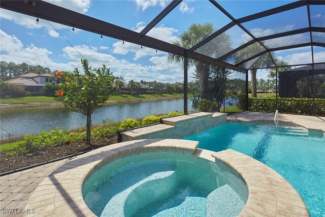 4551 Tamarind Way, Naples, FL 34119 - view of pool with a water view, a pool with connected hot tub, and a lanai