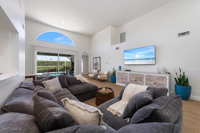 171 Via Napoli, Naples, FL 34105 - living area with wood finished floors, a towering ceiling, and baseboards
