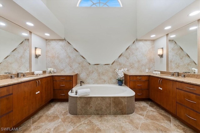 171 Via Napoli, Naples, FL 34105 - full bath with tile walls, recessed lighting, two vanities, and a bath