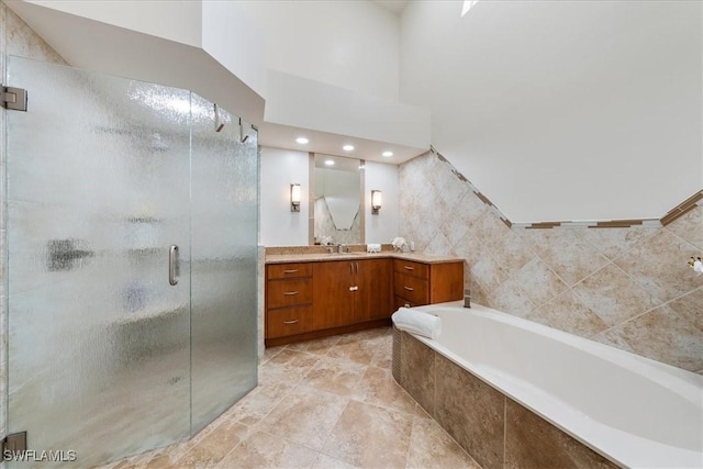 171 Via Napoli, Naples, FL 34105 - full bath featuring vanity, a shower stall, a bath, and recessed lighting
