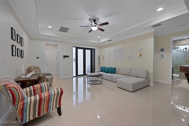 3460 4th Ave NE, Naples, FL 34120 - living room featuring light tile patterned flooring, a ceiling fan, baseboards, a raised ceiling, and crown molding