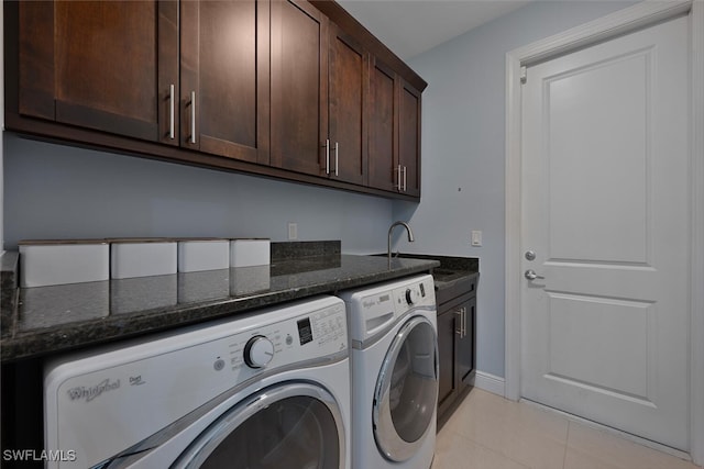 3460 4th Ave NE, Naples, FL 34120 - laundry room with independent washer and dryer, cabinet space, light tile patterned floors, and baseboards