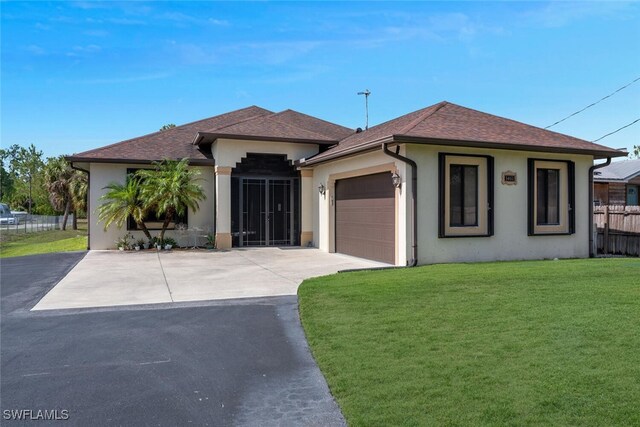 3460 4th Ave NE, Naples, FL 34120 - view of front of house with driveway, stucco siding, an attached garage, and roof with shingles