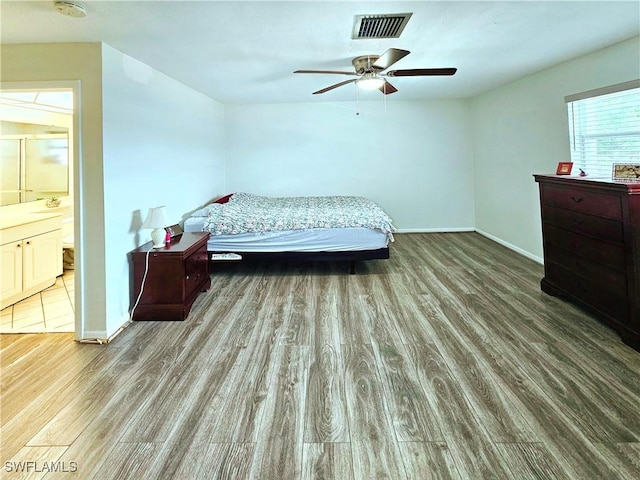 4268 25th Ave SW, Naples, FL 34116 - bedroom with wood finished floors, baseboards, and a ceiling fan