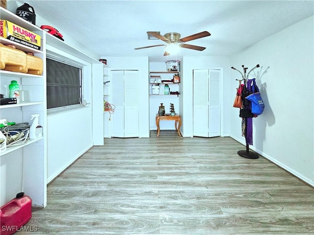 4268 25th Ave SW, Naples, FL 34116 - spare room with wood finished floors, ceiling fan, and baseboards