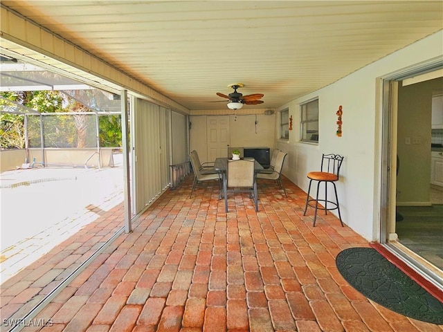 4268 25th Ave SW, Naples, FL 34116 - view of patio featuring ceiling fan, glass enclosure, and outdoor dining space