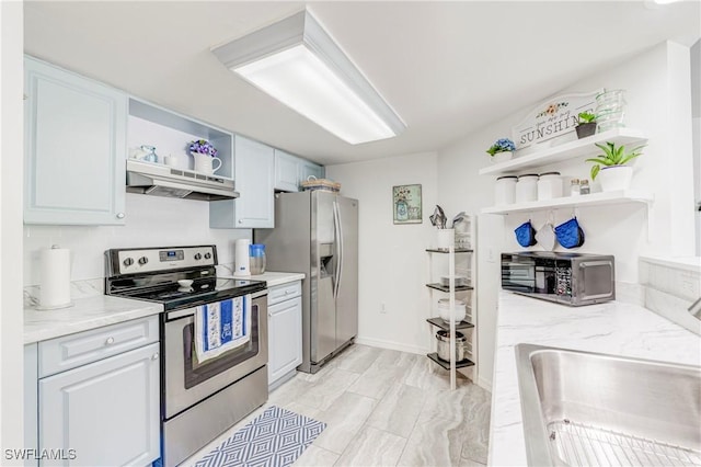 1769 Four Mile Cove Pkwy Unit 915, Cape Coral, FL 33990 - kitchen with open shelves, appliances with stainless steel finishes, under cabinet range hood, a sink, and light stone countertops