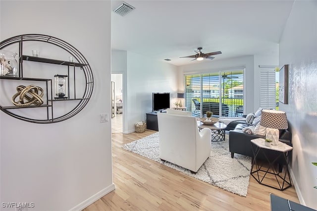 15055 Tamarind Cay Ct Unit 1205, Fort Myers, FL 33908 - living room featuring wood finished floors, a ceiling fan, and baseboards