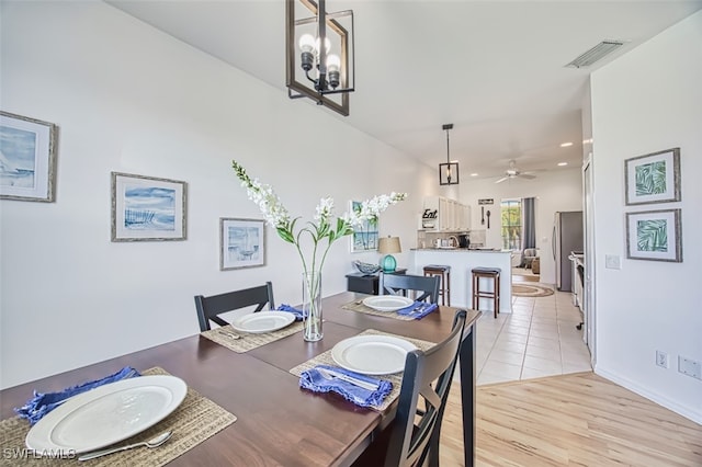 15055 Tamarind Cay Ct Unit 1205, Fort Myers, FL 33908 - dining area with a ceiling fan, light wood-type flooring, recessed lighting, a chandelier, and baseboards
