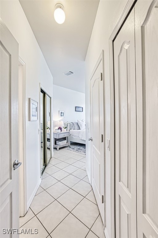 15055 Tamarind Cay Ct Unit 1205, Fort Myers, FL 33908 - hall with light tile patterned floors