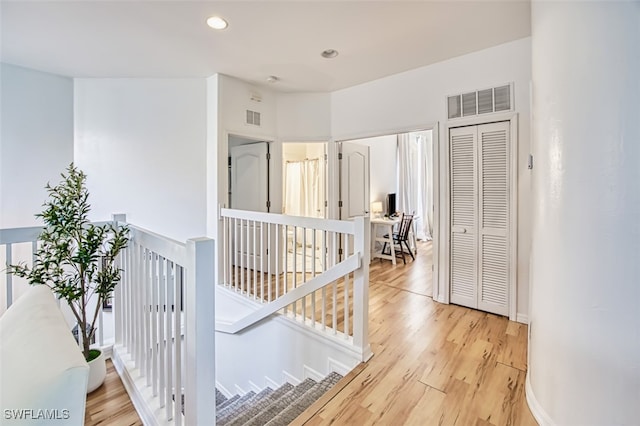15055 Tamarind Cay Ct Unit 1205, Fort Myers, FL 33908 - hall with an upstairs landing, light wood finished floors, and recessed lighting
