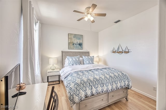 15055 Tamarind Cay Ct Unit 1205, Fort Myers, FL 33908 - bedroom featuring baseboards, wood finished floors, and a ceiling fan