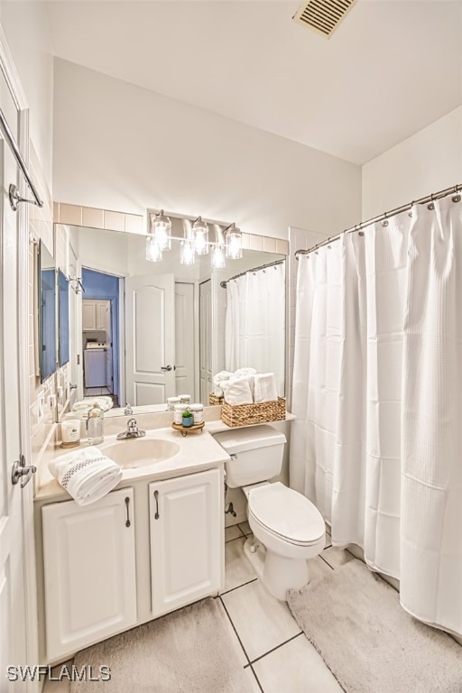 15055 Tamarind Cay Ct Unit 1205, Fort Myers, FL 33908 - bathroom featuring vanity, toilet, and tile patterned flooring