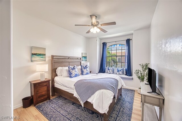 15055 Tamarind Cay Ct Unit 1205, Fort Myers, FL 33908 - bedroom featuring light wood-style floors, baseboards, and ceiling fan