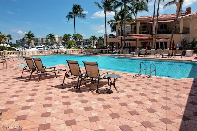 15055 Tamarind Cay Ct Unit 1205, Fort Myers, FL 33908 - community pool featuring a patio